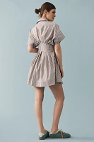 The @heynasreen Tobie Button-Front Pleated Mini Shirt Dress by Exquise