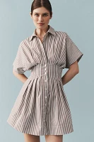 The @heynasreen Tobie Button-Front Pleated Mini Shirt Dress by Exquise