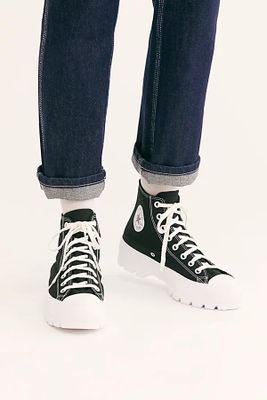Chuck Taylor All Star Lugged Hi Top Sneakers by Converse at Free People, Black / White US