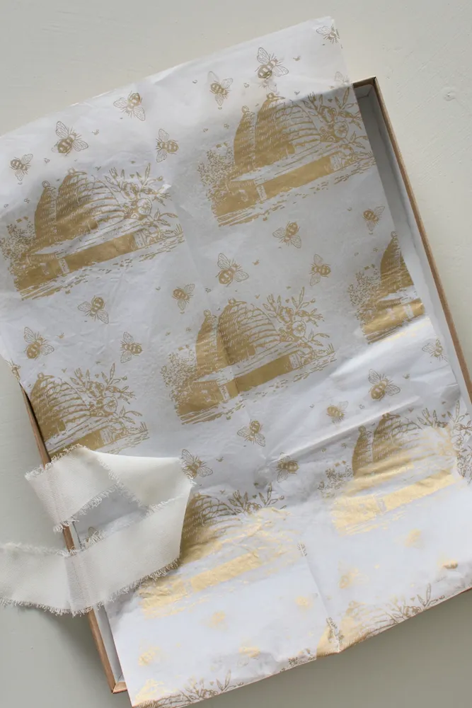 Bee wrapping paper in gold