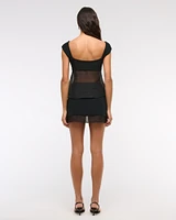 Mid Rise Sheer Hem Mini Skort