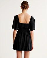 Angel Sleeve Smocked Waist Mini Dress