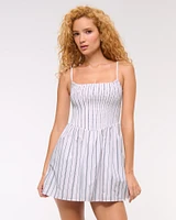 Dipped-Waist Smocked Mini Dress