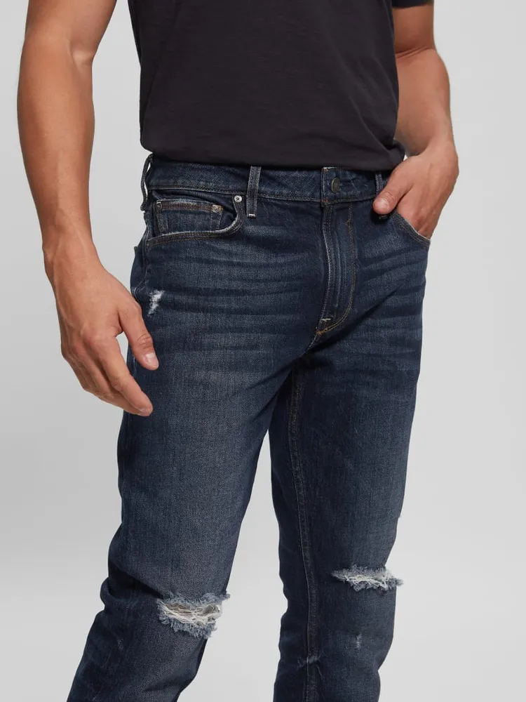 Destroyed Tapered Jeans