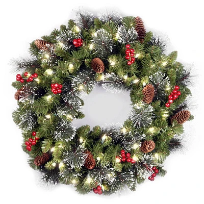 24" Crestwood® Spruce Wreath with Silver Bristle, Pine Cones, Red Berries & Glitter with Warm White LED Lights