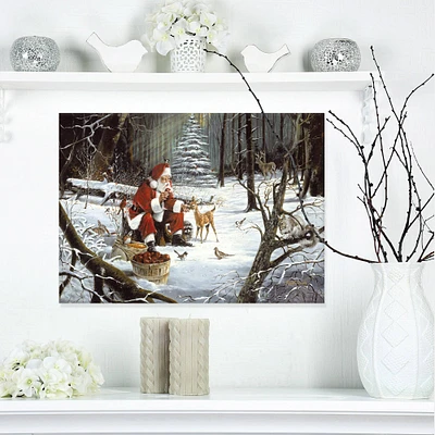 Designart - Santa Claus with deer in snowy woods