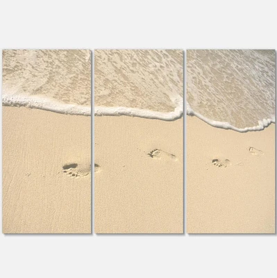 Designart - Footprints in Sand on the Beach