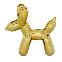 CosmoLiving by Cosmopolitan Gold Ceramic Glam Sculpture