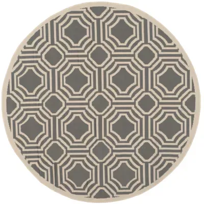 Safavieh Courtyard Collection Torma Geometric Indoor/Outdoor Round Area Rug