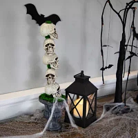 Northlight 16in Skull Tower Topiary In Urn Christmas Tabletop Decor