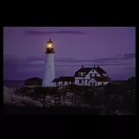 LED Lighted Coastal Lighthouse Home with Sunset Canvas Wall Art 15.75" x 23.5"