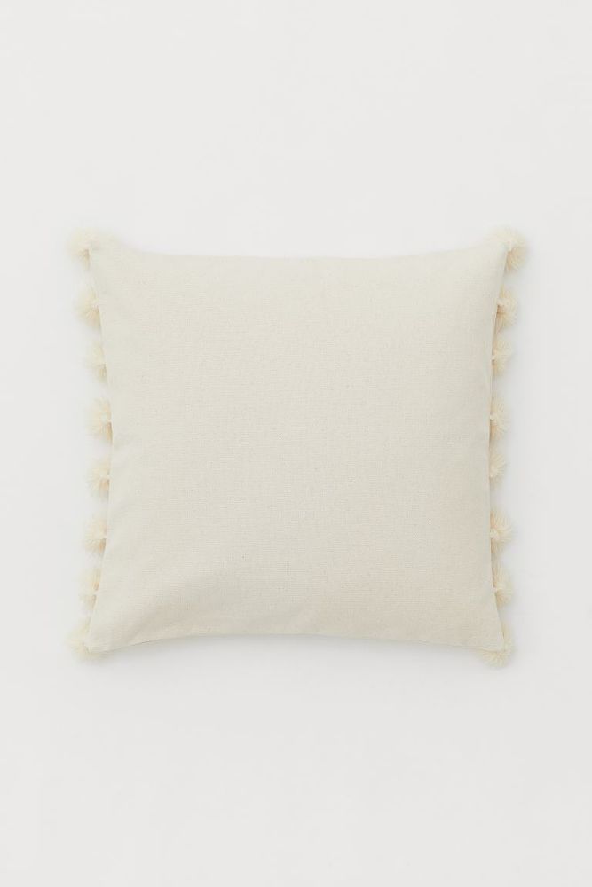 Housse de coussin à pompons