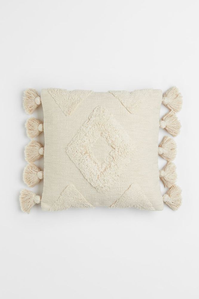 Housse de coussin à pompons