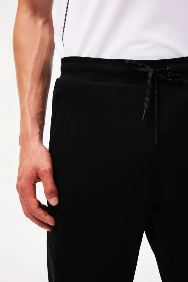 DryMove™ Tapered tech joggers with zipped pockets