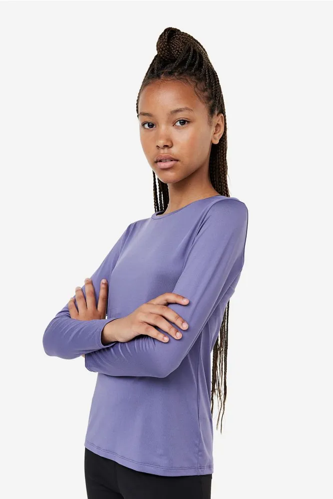 Purple sports top with long sleeves and cut neckline