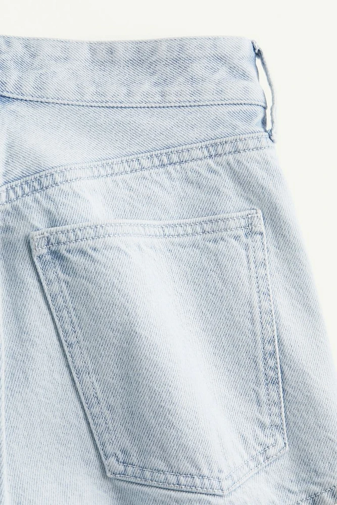 Shorts mini en denim con pliegues