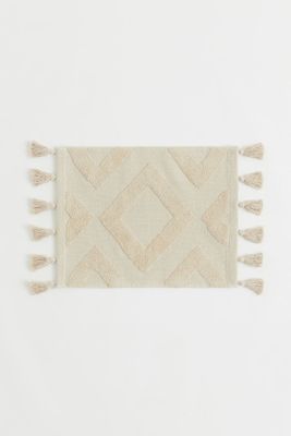 Tapis de bain à pompons