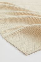 Grand tapis en laine mélangée