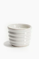 Vela aromática en recipiente de cerámica gres