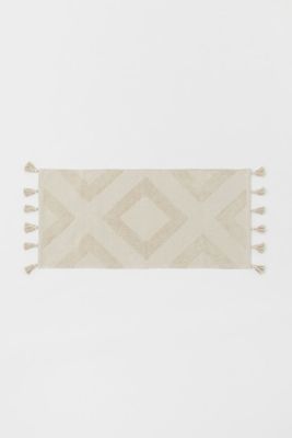 Tapis de bain à pompons