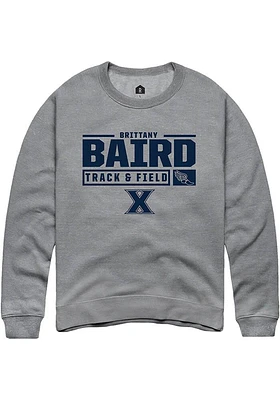 Brittany Baird  Rally Xavier Musketeers Mens Graphite NIL Stacked Box Long Sleeve Crew Sweatshir..