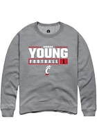 Jordan Young  Rally Cincinnati Bearcats Mens Graphite NIL Stacked Box Long Sleeve Crew Sweatshir..