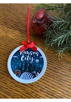 Kansas City Skyline Snowing Ornament - Blue