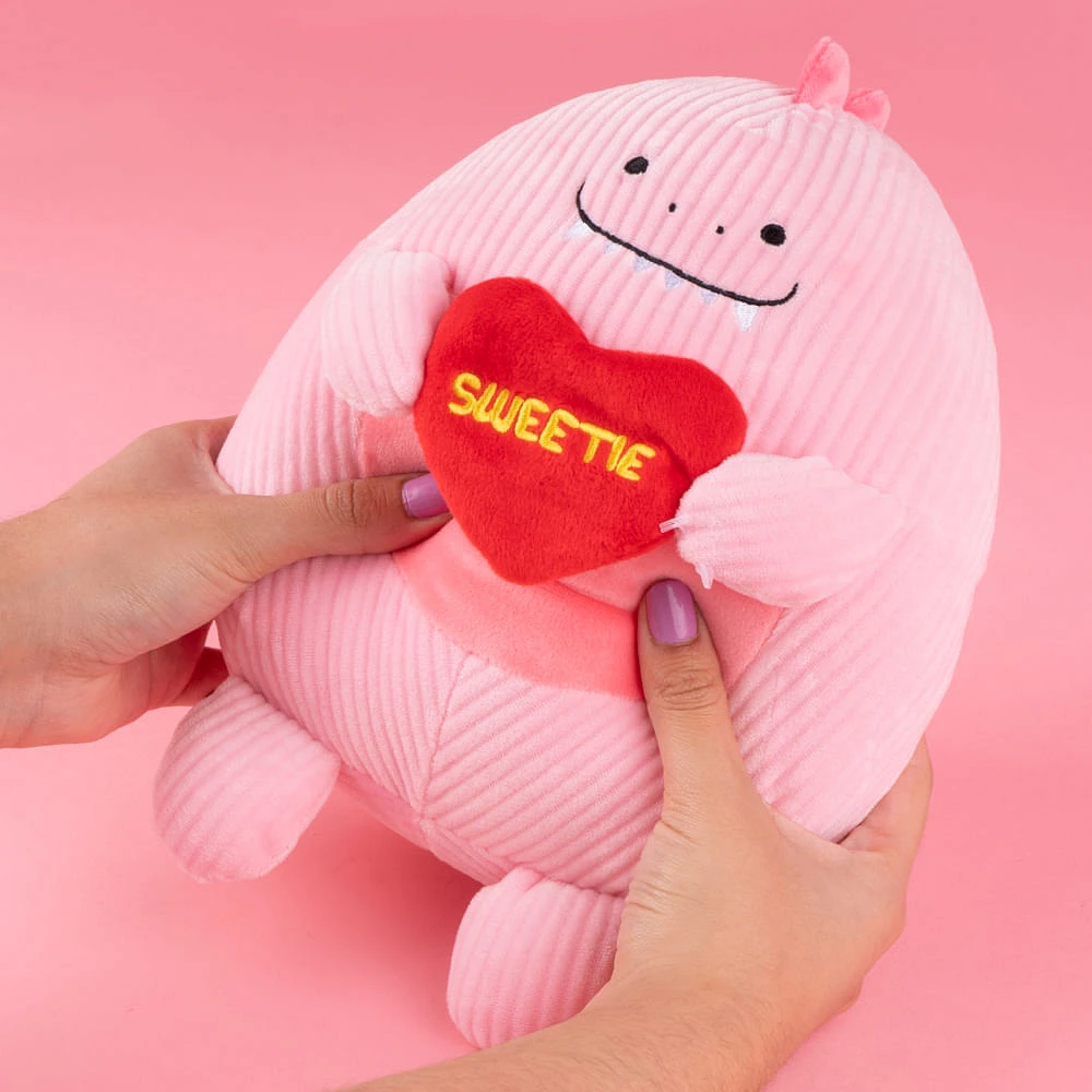 Peluche Miniso  Dinosaurio Minisow Con Corazón Felpa Rosa 20x24 cm