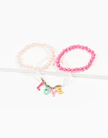 Set de 3 pulseras infantiles de mostacillas con dijes love