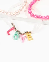 Set de 3 pulseras infantiles de mostacillas con dijes love