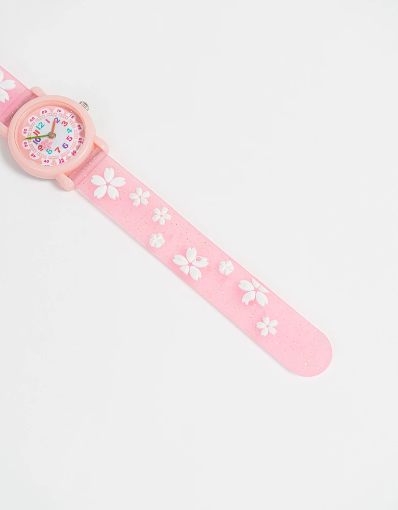 Reloj analógico con flores