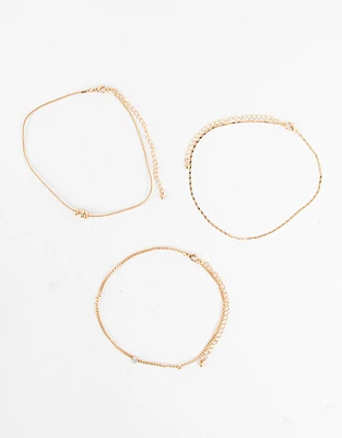 Set de chokers bañados en oro