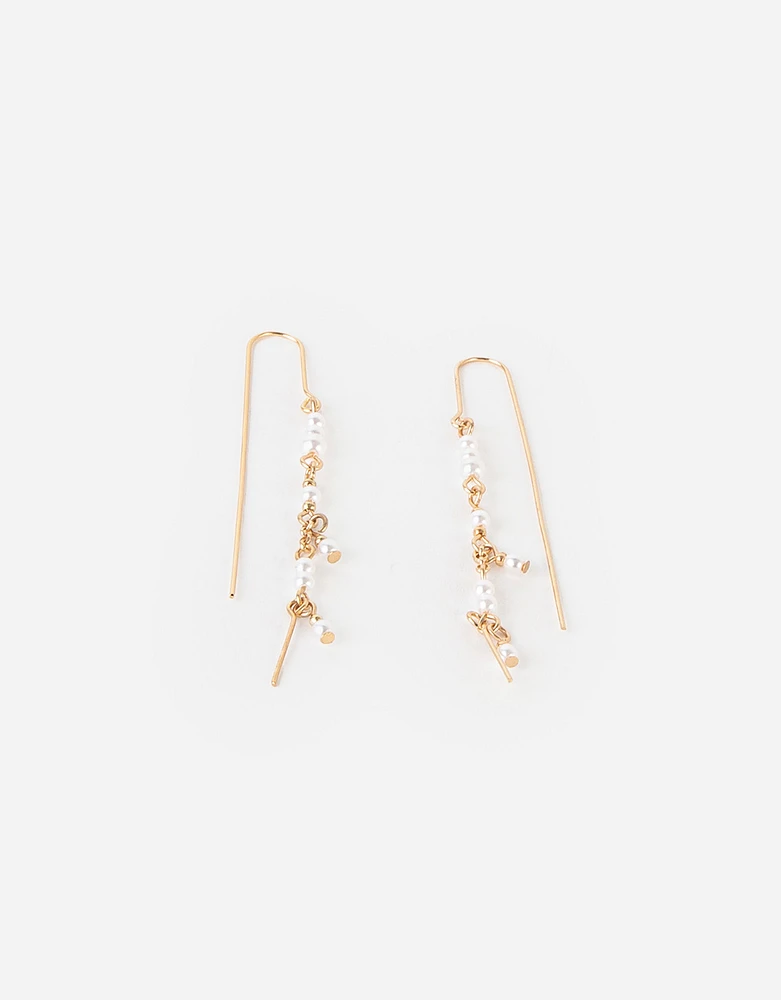 Aretes largos con perlas