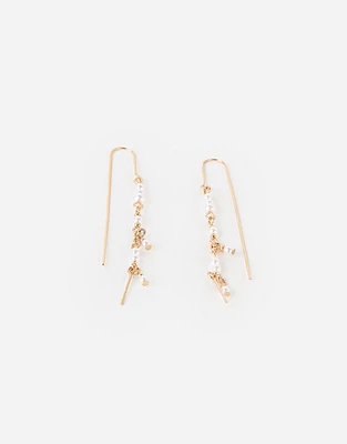 Aretes largos con perlas