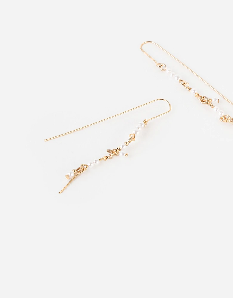 Aretes largos con perlas