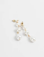 Aretes largos con perlas