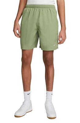 Nike Solo Swoosh Water Repellent Nylon Shorts Oil Green/White at Nordstrom,