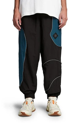 Puma X P. A.M. Cellerator Water Repellent Track Pants Black at Nordstrom,