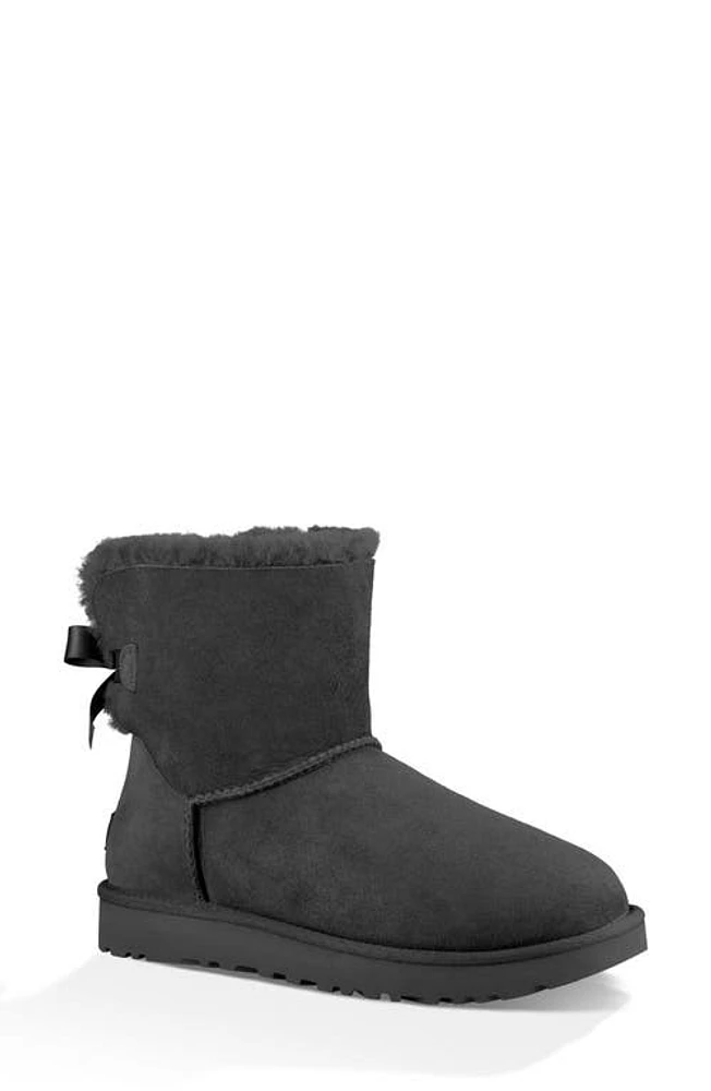 UGG(r) Mini Bailey Bow II Genuine Shearling Bootie in Black Suede at Nordstrom, Size 6