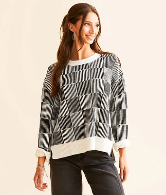 AEMI + CO Checker Ribbed Sweater