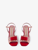 Zapatilla de piel grabada con moño en color rojo para mujer