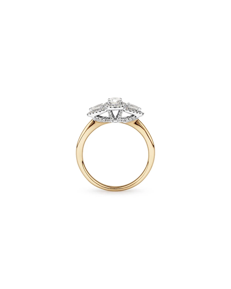 0.69 Carat TW Three Stone Oval and Pear Cut Diamond Halo Engagement Ring in 14kt Yellow and White Gold