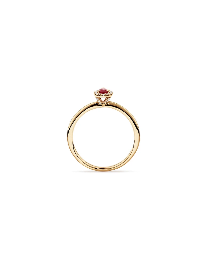 Pear Cut Red Ruby Gemstone and 0.08 Carat TW Diamond Halo Ring in 10kt Yellow Gold