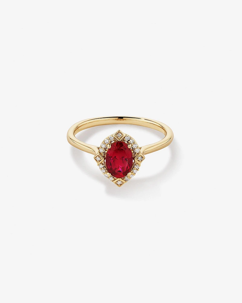 Oval Cut Created Ruby and Diamond Halo Ring in 10kt Yellow Gold