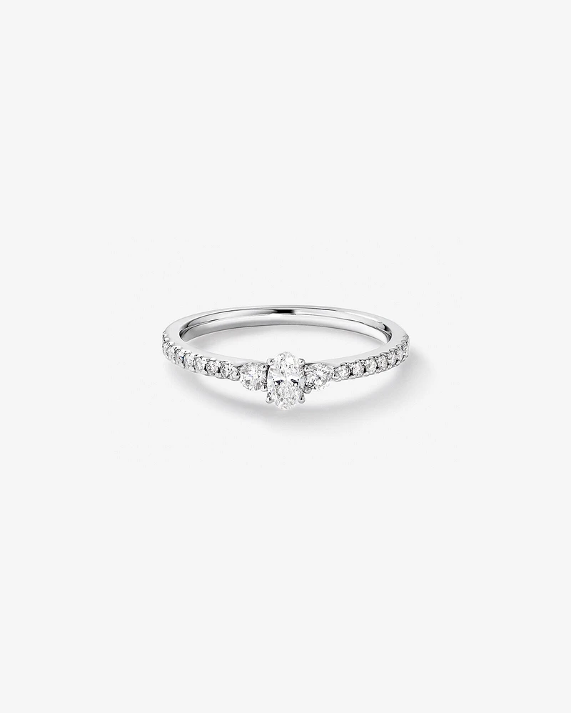 0.40 Carat TW Oval and Round Brilliant Three Stone Side Accent Engagement Ring in 14kt White Gold