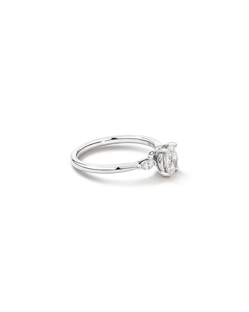 0.77 Carat TW Three Stone Oval and Marquise Cut Hidden Halo Engagement Ring in Platinum