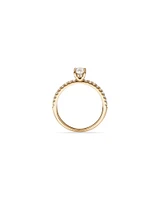 0.73 Carat TW Oval Cut Diamond and Round Brilliant Side Accent Engagement Ring in 14kt Yellow Gold