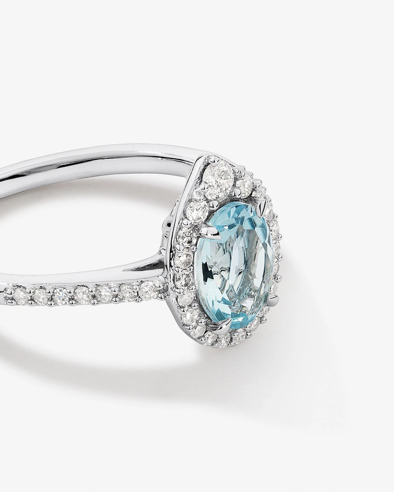 Halo Ring with Aquamarine & 0.29 Carat TW of Diamonds in 10kt White Gold