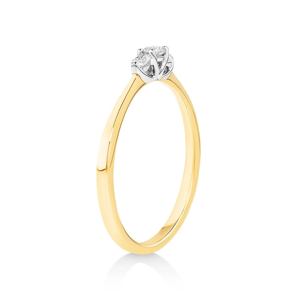 0.15 Carat TW Three Stone Round Brilliant and Oval Cut Diamond Promise Ring in 10kt Yellow and White Gold