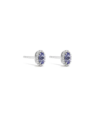 Oval Cut Blue Tanzanite Gemstone and 0.12 Carat TW Diamond Halo Stud Earrings in 10kt White Gold